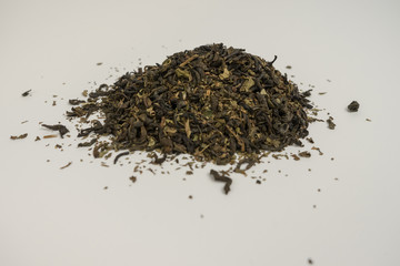 Classic green rosehip tea on a white background