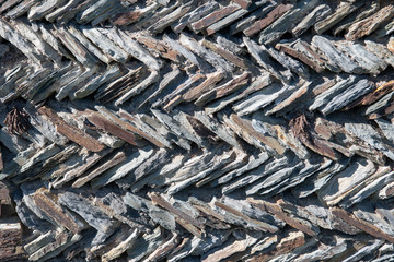 close up of traditional Cornish slate herring bone patterned wall