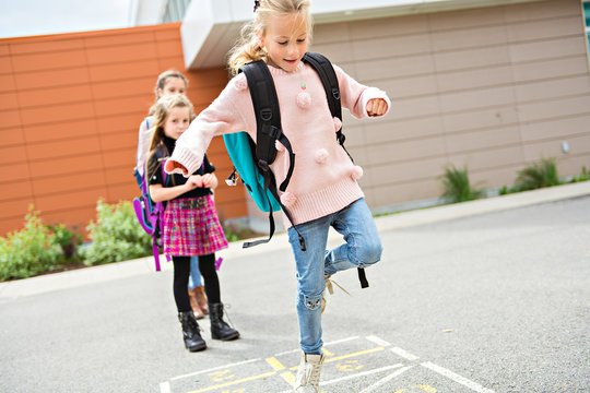 A Hopscotch on the schoolyard with friends play together