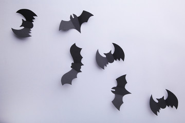 Fototapeta premium Halloween paper bats on grey background. Halloween concept