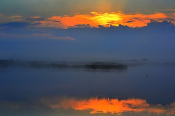 a sunrise at the lake