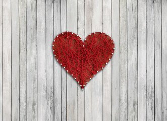 red heart on wooden board