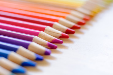 group of drawing color pencils on wooden background