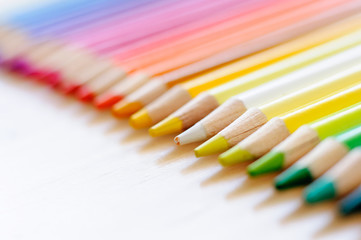 group of drawing color pencils on wooden background