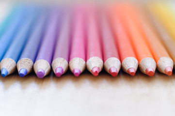 group of drawing color pencils on wooden background