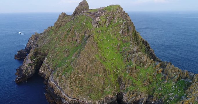 Wide aerial, coastal cliffs in Skellig Michael