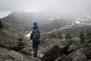 A child being carried by his father while hiking Lake O’hara, British Columbia, Canada