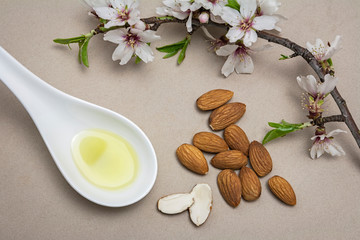 Fototapeta na wymiar Almond oil in capsules isolated on brown background