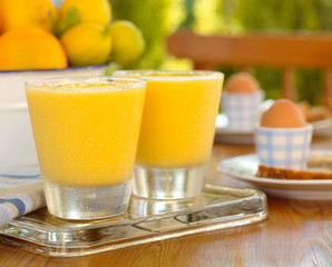 Feshly squeezed Breakfast Orange Juice in glasses in breakfast setting