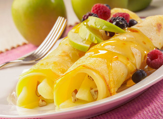 Apple Pancakes with fruit on plate with fork