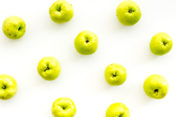 Green apples pattern on white background top view
