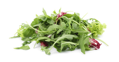 Heap of fresh salad greens on white background