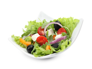 Tasty salad of fresh ingredients on white background