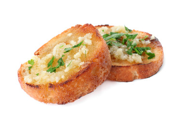 Slices of toasted bread with garlic and herb on white background