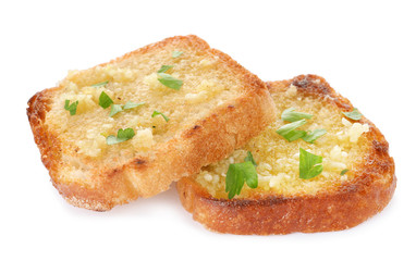 Slices of toasted bread with garlic and herb on white background