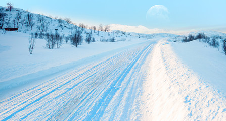 Fototapeta na wymiar Beautiful winter landscape with snow and ice covered road - Arctic landscape - Snow covered road on a winter day - Tromso, Norway