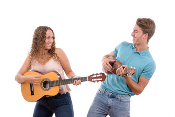 two young Caucasian brothers or couple playing a guitar and a ukulele having fun together at a party with white background isolated