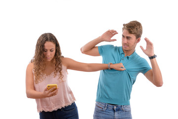 angry couple because they have read or seen some infidelities on their partner's mobile phone isolated in white background
