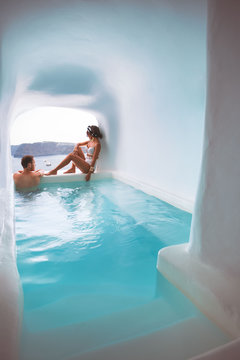 Couple in small pool with view of sea