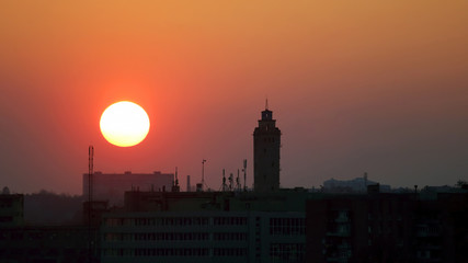 sunset on a background of city buildings