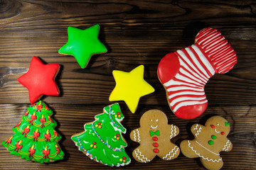 Tasty festive Christmas gingerbread cookies on wooden table. Top view