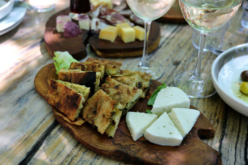 Albanian food in the famous restaurant Mrizi I Zanave in village Fishte, region of Zadrima. Domestic food appetizers and wine.