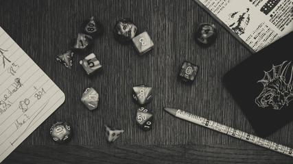 Pen and Paper scene with dice in black and white
