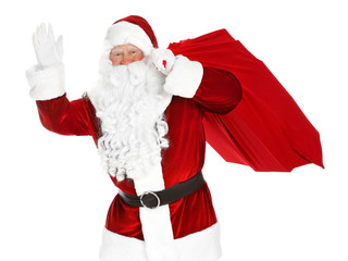 Authentic Santa Claus with bag full of gifts on white background