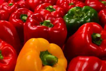 Fresh red, green, yellow bell pepper background.