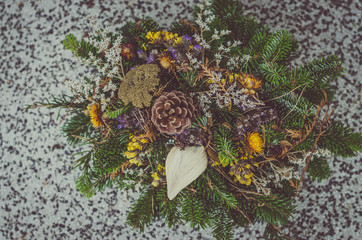 floral decoration on grave during All Saints Day in the cemetery