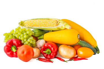 Tomato garlic red onion Golden grapes, eggplant, pink zucchini corn on the cob with bell and chili peppers on white background