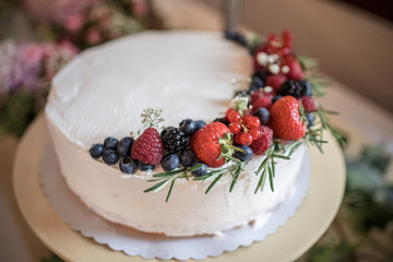 White wedding cake with berries