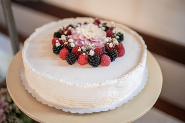 White wedding cake with berries