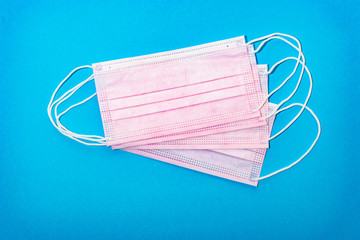 Protective medical mask on a blue background.