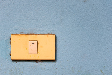 Old switch with old blue wall