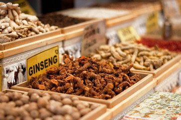 Multi-colored dried fruits and tea in the oriental bazaar.