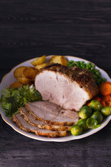 Roasted sliced ham and vegetables. Room for text