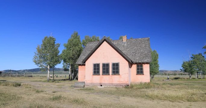 Mormon Row Jackson Wyoming old house Grand Teton. Pioneer settler homestead farms ranch. Historic building scenic landscape. 2.5 million visitors a year. Geography, geology, environment.