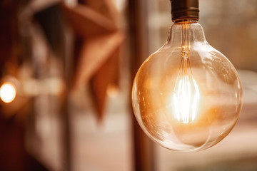 Edison retro glass lamp included light, in background cardboard star, loft style