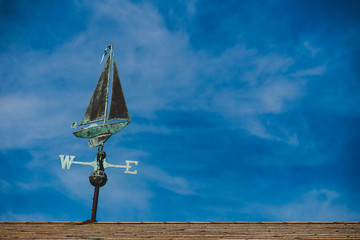 weather vane on the roof of a dock