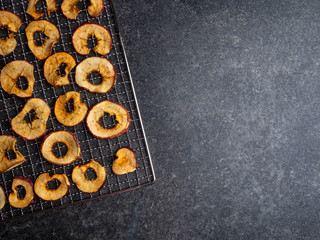 Dried slices of red and yellow dehydrated apples