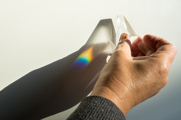 Demonstration of breaking and dispersion of light in a prism. Physics optics experiment. 