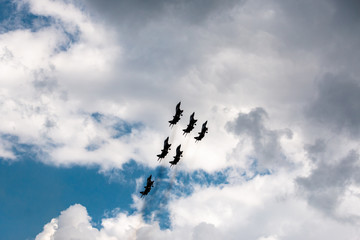 military aircraft flying in the background of clouds