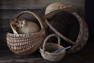 Three baskets and two straw hats.