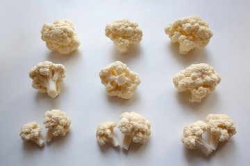 White cauliflower pieces pattern isolated on white background
