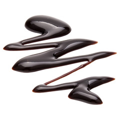 Obraz premium Chocolate syrup drop isolated on white background