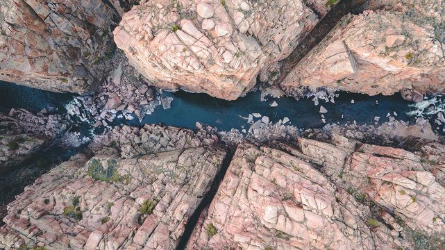 Aerial view of river between mountains