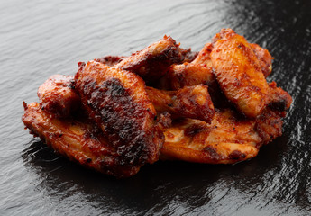 Fried wings close-up. Buffalo wings on a slate surface.