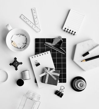 Assorted White And Black Colored Office Items