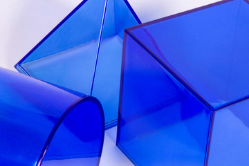 Light blue plastic geometric shapes on a white background